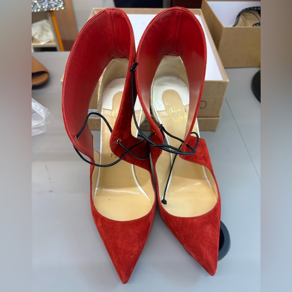 Red Louboutin Pumps